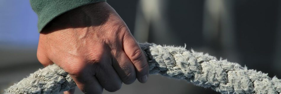 person holding a white rope