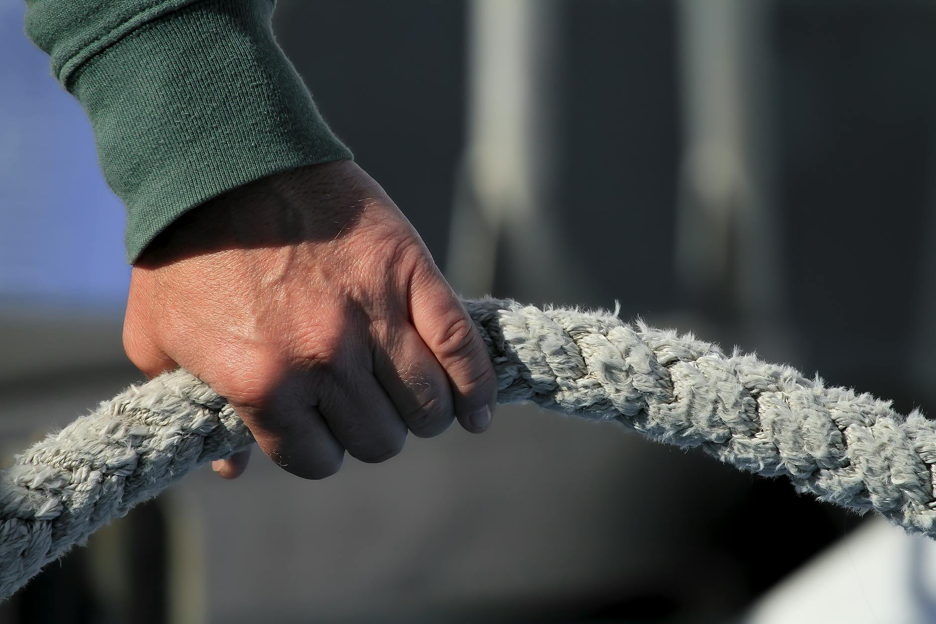 person holding a white rope